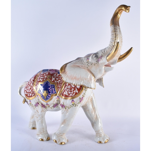 433 - A VERY LARGE LATE 19TH CENTURY GERMAN DRESDEN PORCELAIN FIGURE OF AN ELEPHANT painted with flowers a... 