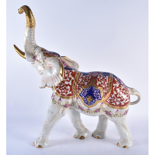 433 - A VERY LARGE LATE 19TH CENTURY GERMAN DRESDEN PORCELAIN FIGURE OF AN ELEPHANT painted with flowers a... 