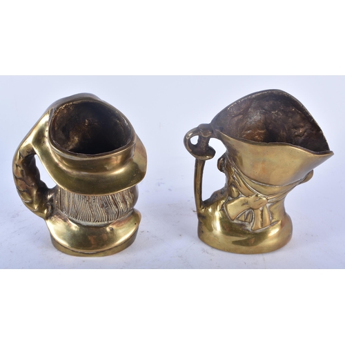 437 - A RARE PAIR OF 19TH CENTURY ENGLISH BRONZE CHARACTER JUGS modelled as male and pirate. 11cm x 9 cm.