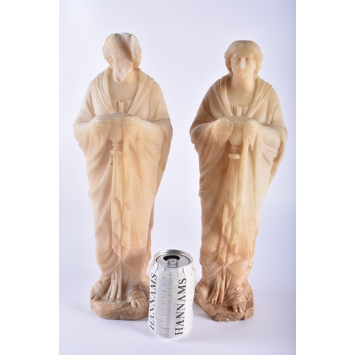 465 - A LARGE PAIR OF 19TH CENTURY EUROPEAN CARVED ALABASTER FIGURES OF SAINTS modelled in flowing robes. ... 