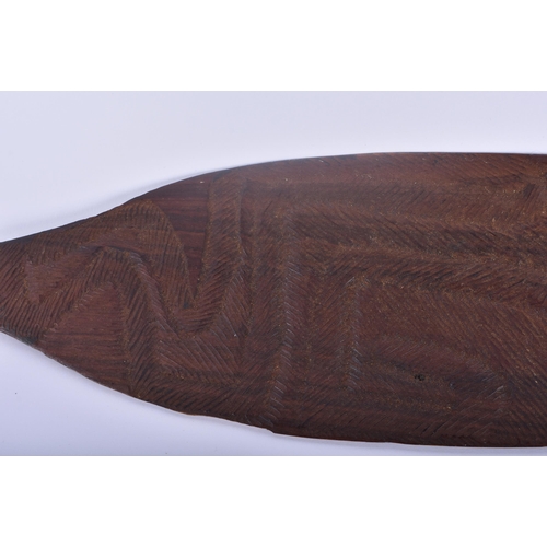 466 - TWO ABORIGINAL TRIBAL CARVED WOOD SHORT PADDLES engraved with motifs. 70 cm long. (2)