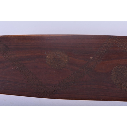 466 - TWO ABORIGINAL TRIBAL CARVED WOOD SHORT PADDLES engraved with motifs. 70 cm long. (2)