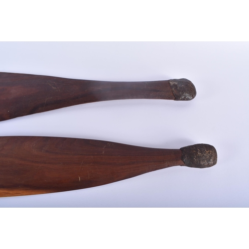 466 - TWO ABORIGINAL TRIBAL CARVED WOOD SHORT PADDLES engraved with motifs. 70 cm long. (2)