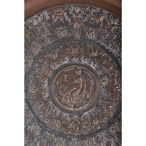 467 - A LARGE 19TH CENTURY EUROPEAN REPOUSSE BRONZE COUNTRY HOUSE CHARGER decorated with nude figures and ... 