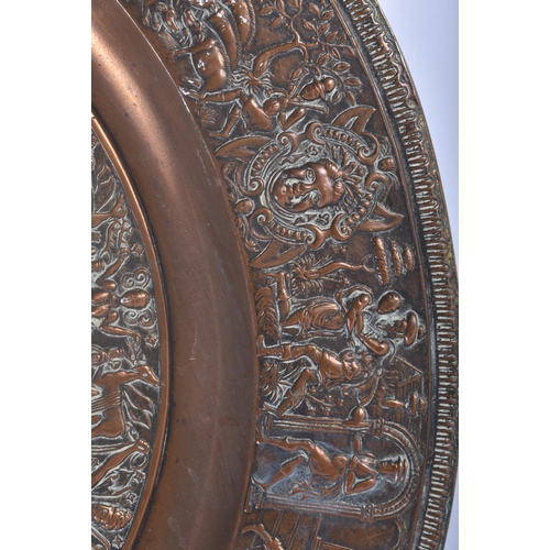 467 - A LARGE 19TH CENTURY EUROPEAN REPOUSSE BRONZE COUNTRY HOUSE CHARGER decorated with nude figures and ... 