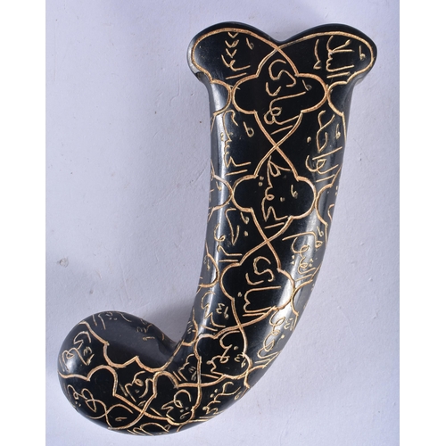 513 - AN ISLAMIC MIDDLE EASTERN CARVED JADE DAGGER HANDLE decorated all over with calligraphy. 13 cm x 6 c... 