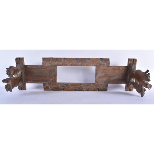 516 - A 19TH CENTURY BAVARIAN BLACK FOREST CARVED LINDEN WOOD EXTENDING BOOK RACK formed with two bears cl... 