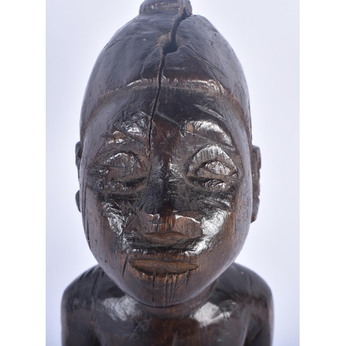 524 - AN AFRICAN TRIBAL CARVED WOOD FERTILITY FIGURE. 28 cm high.