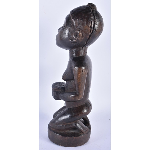 524 - AN AFRICAN TRIBAL CARVED WOOD FERTILITY FIGURE. 28 cm high.