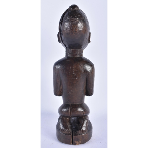 524 - AN AFRICAN TRIBAL CARVED WOOD FERTILITY FIGURE. 28 cm high.