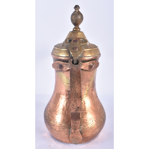 529 - AN ISLAMIC MIDDLE EASTERN TURKISH COPPER ALLOY EWER. 24 cm x 24 cm.