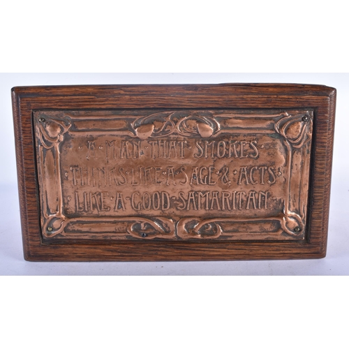 531 - AN ART NOUVEAU COPPER INSET OAK TEA CADDY decorated in relief with a scrolling plaque depicting foli... 