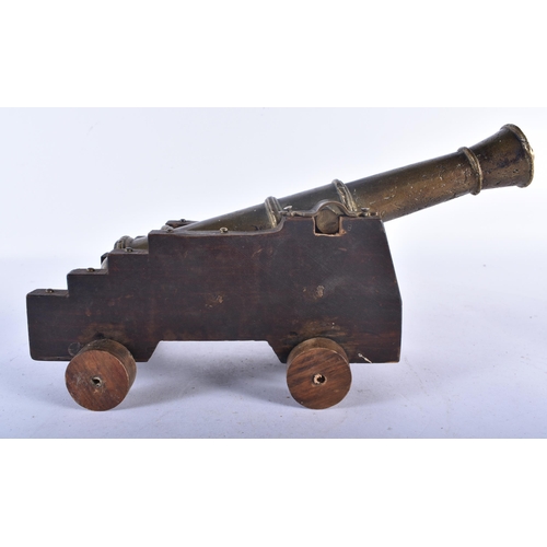 533 - AN ANTIQUE COUNTRY HOUSE GENTLEMANS BRONZE DESK CANNON. 25cm long.