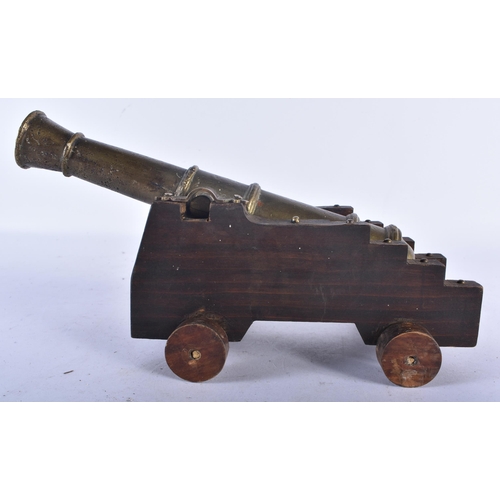 533 - AN ANTIQUE COUNTRY HOUSE GENTLEMANS BRONZE DESK CANNON. 25cm long.