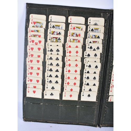 535 - A VINTAGE LEATHER CASED TRAVELLING SOLITAIRE CARD GAME. 24 cm x 15 cm.