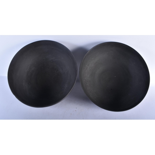 538 - A RARE LARGE PAIR OF LATE 18TH CENTURY WEDGWOOD BLACK BASALT PUNCH BOWLS of plain elegant form. 30cm... 