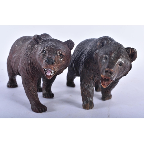 545 - A PAIR OF 19TH CENTURY BAVARIAN BLACK FOREST CARVED WOOD BEARS modelled roaming. 18cm x 10 cm.