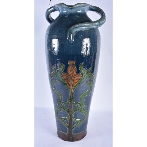 546 - A VERY LARGE ART NOUVEAU PAINTED POTTERY FLOOR VASE Attributed to Brannam. 60 cm x 18cm.