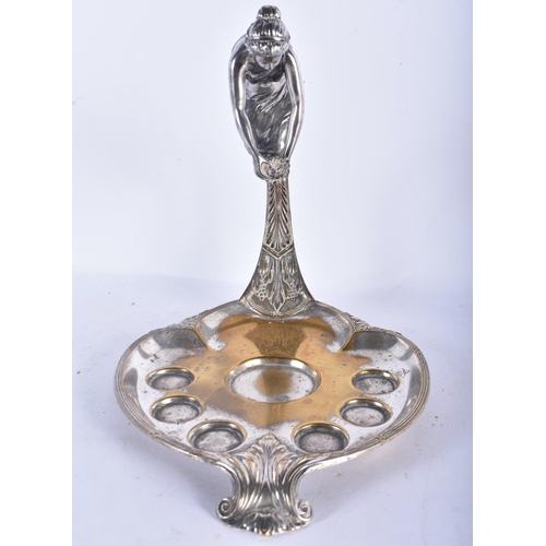 550 - AN UNUSUAL WMF SILVER PLATED DECANTER AND GLASS STAND formed with a leaning female. 24 cm x 18cm.