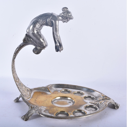 550 - AN UNUSUAL WMF SILVER PLATED DECANTER AND GLASS STAND formed with a leaning female. 24 cm x 18cm.