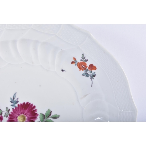 557 - AN 18TH/19TH CENTURY MEISSEN SCALLOPED PORCELAIN PLATE painted with flowers. 22 cm wide.