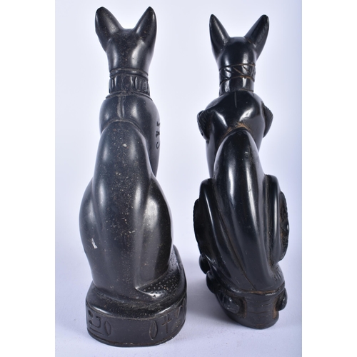 566 - AN ANTIQUE EGYPTIAN REVIVAL BRONZE SPHINX together with a pair of cats. Largest 16 cm high. (3)