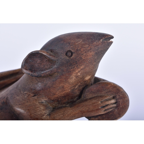 569 - AN EARLY 20TH CENTURY JAPANESE MEIJI PERIOD CARVED WOOD OKIMONO modelled as a rat pulling a sack. 24... 