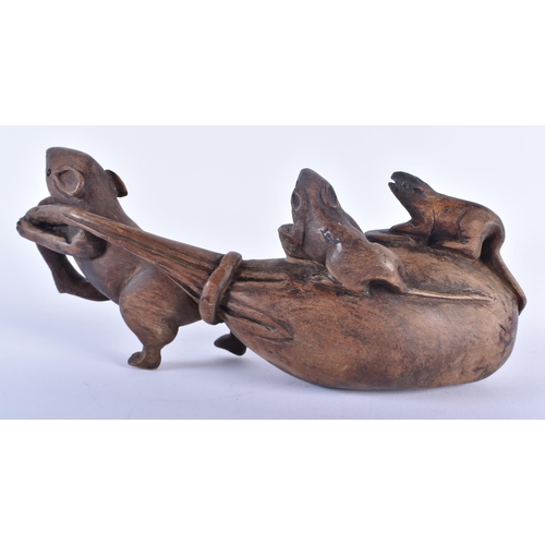 569 - AN EARLY 20TH CENTURY JAPANESE MEIJI PERIOD CARVED WOOD OKIMONO modelled as a rat pulling a sack. 24... 