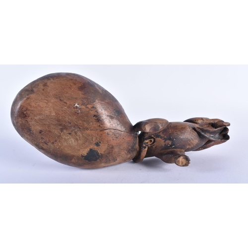 569 - AN EARLY 20TH CENTURY JAPANESE MEIJI PERIOD CARVED WOOD OKIMONO modelled as a rat pulling a sack. 24... 