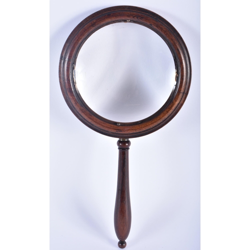 577 - A LARGE ANTIQUE COUNTRY HOUSE MAHOGANY MAGNIFYING MIRROR. 30cm long.