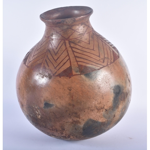 580 - A NORTH AMERICAN TRIBAL POTTERY BULBOUS VASE painted with a lozenge type decoration. 35 cm x 23 cm.