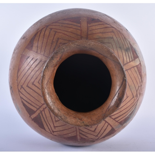 580 - A NORTH AMERICAN TRIBAL POTTERY BULBOUS VASE painted with a lozenge type decoration. 35 cm x 23 cm.