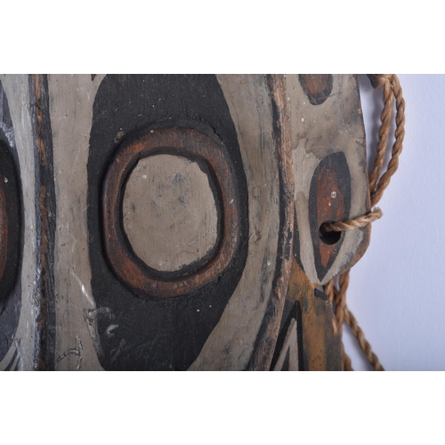 589 - A PAPUA NEW GUINEA SEPIK RIVER TRIBAL WOOD MASK. 42 cm x 18cm.