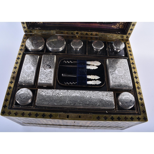 592 - A FINE EARLY 19TH CENTURY FRENCH BRONZE OVERLAID WOOD CASKET with fully fitted silver interior, the ... 