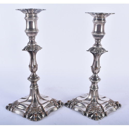 593 - A PAIR OF GEORGE III OLD SHEFFIELD PLATED CANDLESTICKS. 1134 grams. 23 cm x 11cm.