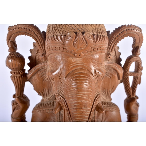 601 - A LATE 19TH CENTURY INDIAN CARVED SANDALWOOD FIGURE OF GANESHA. 33 cm x 10 cm.