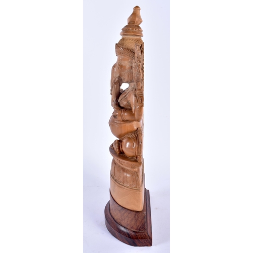 601 - A LATE 19TH CENTURY INDIAN CARVED SANDALWOOD FIGURE OF GANESHA. 33 cm x 10 cm.