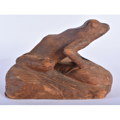 603 - A MOUSEMAN STYLE CARVED PINE FIGURE OF A FROG. 20 cm x 14 cm.