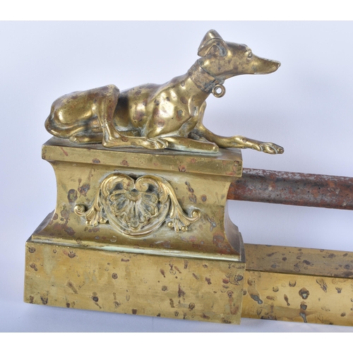 605 - A LOVELY REGENCY COUNTRY HOUSE ORMOLU AND STEEL GREYHOUND FENDER formed with two recumbent hounds. 9... 