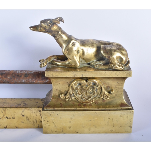 605 - A LOVELY REGENCY COUNTRY HOUSE ORMOLU AND STEEL GREYHOUND FENDER formed with two recumbent hounds. 9... 