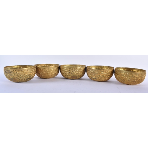 607 - A SET OF FIVE ANTIQUE ASIAN REPOUSSE BOWLS together with a pair of Anglo Indian elephant bookends. L... 