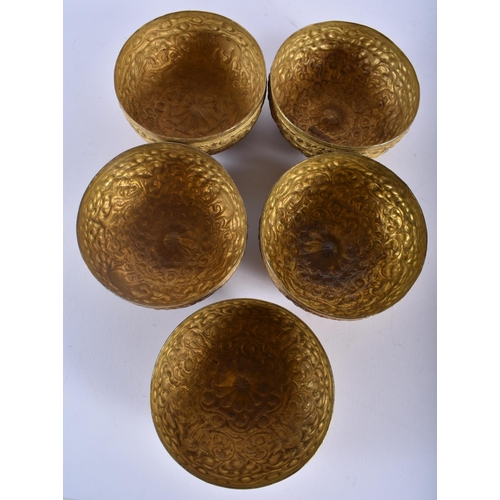 607 - A SET OF FIVE ANTIQUE ASIAN REPOUSSE BOWLS together with a pair of Anglo Indian elephant bookends. L... 