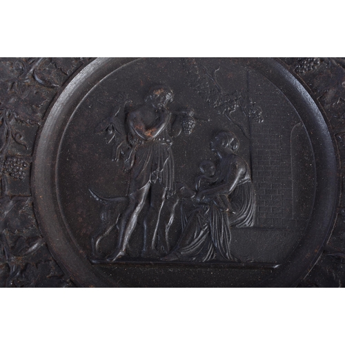 611 - A SET OF FOUR 19TH CENTURY GRAND TOUR CAST IRON CLASSICAL PLAQUES decorated with a border of grape v... 