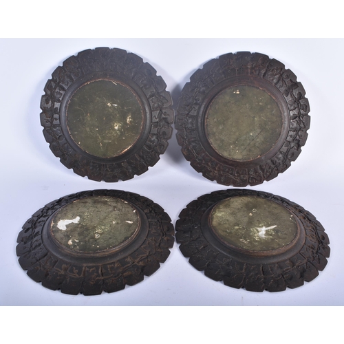 611 - A SET OF FOUR 19TH CENTURY GRAND TOUR CAST IRON CLASSICAL PLAQUES decorated with a border of grape v... 