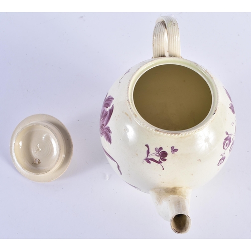 65 - AN 18TH CENTURY ENGLISH CREAMWARE TEAPOT AND COVER painted with flowers. 18cm wide.