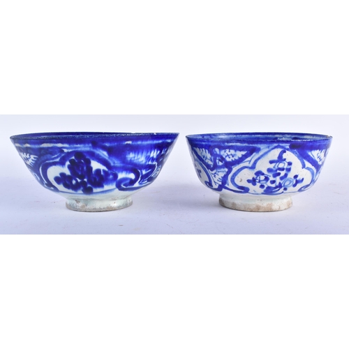 655 - TWO ANTIQUE PERSIAN SAFAVID BLUE AND WHITE POTTERY BOWLS. Largest 18cm wide. (2)