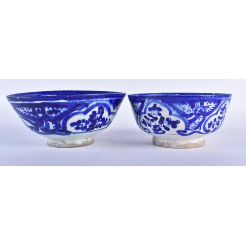 655 - TWO ANTIQUE PERSIAN SAFAVID BLUE AND WHITE POTTERY BOWLS. Largest 18cm wide. (2)