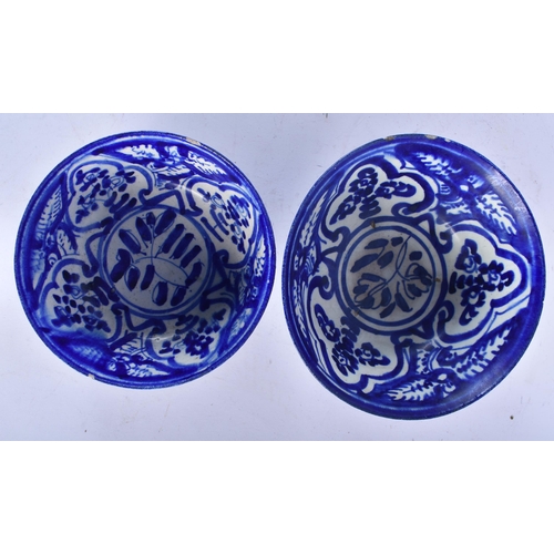 655 - TWO ANTIQUE PERSIAN SAFAVID BLUE AND WHITE POTTERY BOWLS. Largest 18cm wide. (2)