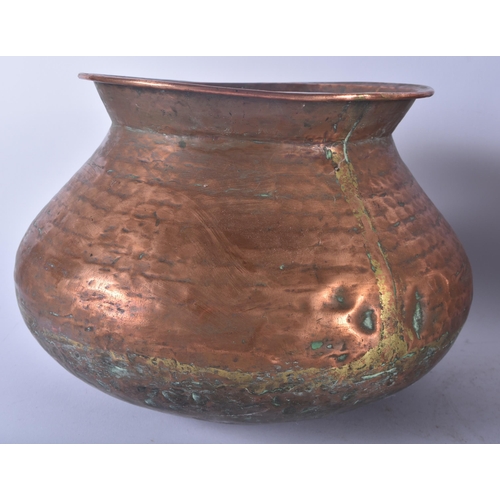 657 - A LARGE EARLY 20TH CENTURY MALAYSIAN HAMMERED COPPER COOKING POT together with other dishes & a Vict... 