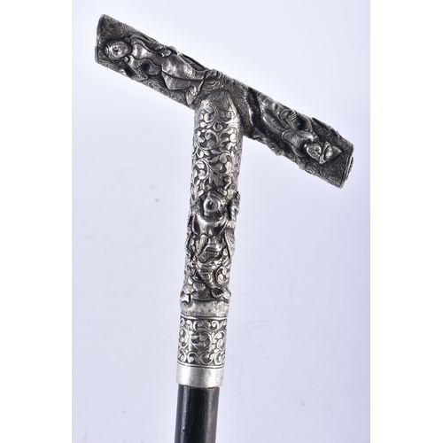 669 - A 19TH CENTURY SOUTH EAST ASIAN SILVER MOUNTED WALKING CANE. 90 cm long.